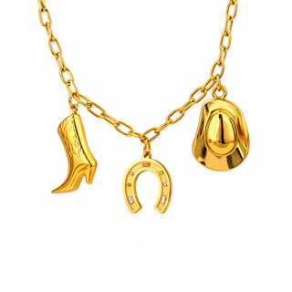 Gold Nashville charm necklace featuring a cowboy boot, horseshoe and hat on a polished link chain. Modern western-inspired design in rich 18k gold tones, photographed on a clean white background for Forward & Tame.