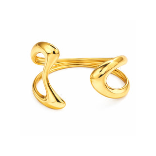 Gold sculptural open cuff bracelet with smooth, fluid curves and a high-shine polished finish, photographed on a clean white background. Modern, bold and luxurious statement piece from Forward & Tame.