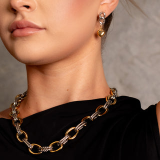 Model wearing the SoHo Lock & Heart Earrings with the Fifth Avenue Two-Toned Necklace, showcasing the mixed-metal styling.