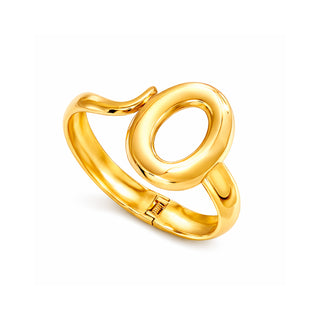 Gold sculptural Spencer Lock bangle featuring a modern open-oval design and a polished high-shine finish. Photographed on a clean white backdrop for Forward & Tame.