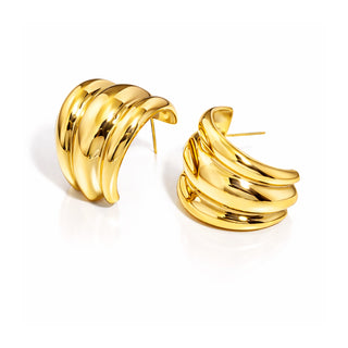 Gold triple-band hoop earrings with a high-shine, polished finish, photographed on a clean white background. Modern, bold and luxe statement hoops from Forward & Tame.