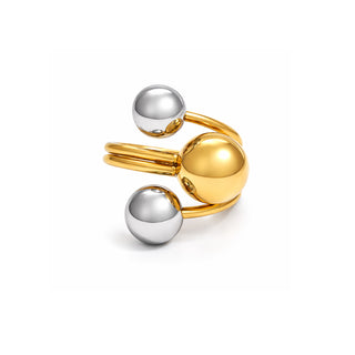 Two-tone open ring featuring a polished gold sphere paired with two smooth stainless steel spheres on a double gold band. High-shine modern design, photographed on a clean white background for Forward & Tame.