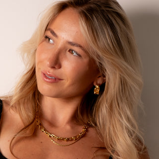 Alana Textured Hoops 18k gold molten textured hoop earrings worn with layered gold necklaces