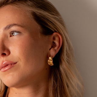 Alana Textured Hoops 18k gold sculptural molten hoop earrings close up on ear
