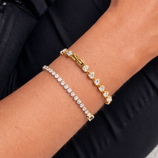 Emmy Tennis Bracelet stacked with Lyla Love Tennis Bracelet gold CZ bracelets on wrist
