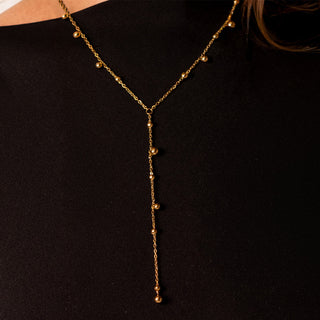Leah Drop V Necklace 18k gold beaded Y-drop lariat necklace styled with Elegance Collection gold jewellery
