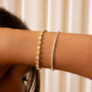 Lyla Love Tennis Bracelet 18k gold heart CZ tennis bracelet stacked with Emmy Tennis Bracelet on wrist
