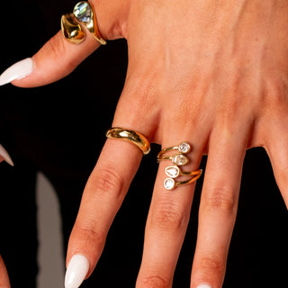 Olympia Band Ring 18k gold sculptural band ring styled with Isola Gem Ring and CZ gold rings
