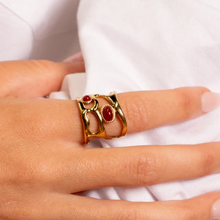 Ruby Liquid Ring 18k gold red agate sculptural open band ring close up on finger