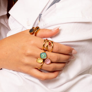 Ruby Liquid Ring 18k gold red agate ring stacked with gold statement rings lifestyle
