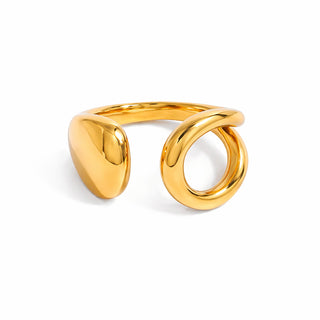 Close-up of a sculptural gold ring featuring an open-ended design with a smooth teardrop end and a rounded loop end. The polished 18k gold-plated finish reflects light beautifully against a crisp white background.